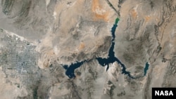 The image shows Lake Mead on the Nevada-Arizona state border at its lowest point ever, taken by the Thematic Mapper on the Landsat 5 satellite, May 2016.
