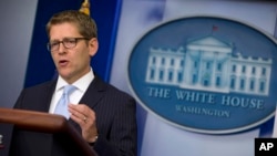 White House press secretary Jay Carney gestures during the daily press briefing at the White House, Aug. 26, 2013.