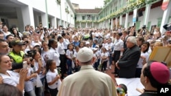 FILE - Pope Francis pays a visit to "Hogar San José" children's home in Medellin, Colombia, Saturday, Sept. 9, 2017.