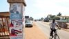 A pillar in Accra features posters for the Dec 7 national elections. (AFP)