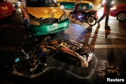 FILE - The positions of colliding vehicles are marked at the site of a road accident during the Songkran festival in Bangkok, Thailand.