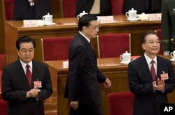 2009年胡锦涛、温家宝和李克强出席中国人大会议。（2009年3月13日）