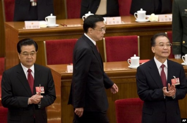 2009年胡锦涛、温家宝和李克强出席中国人大会议。（2009年3月13日）