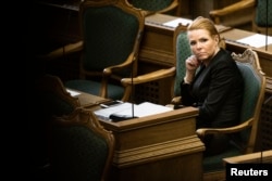 Denmark's Minister of Immigration and Integration Inger Stojberg listens to the debate in the Danish Parliament, Jan. 26, 2016.