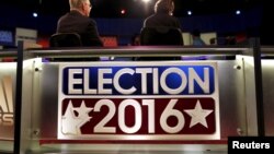 FILE - Crew members prepare for the Fox Business News Republican Presidential Debate at the North Charleston Coliseum in North Charleston, South Carolina, Jan. 13, 2016. 