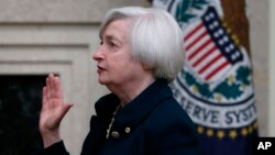 Janet Yellen is sworn in as Federal Reserve Board Chair, in Washington, Monday, Feb. 3, 2014. Yellen the first woman to lead the Federal Reserve in its 100-year history.