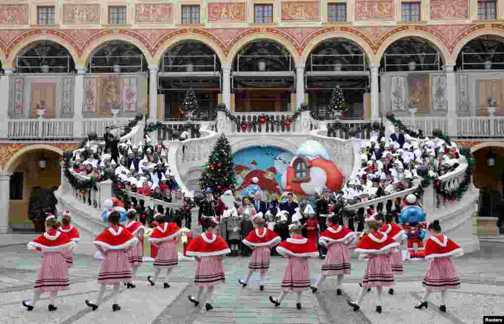 Prince Albert II of Monaco, his wife Princess Charlene and Princess Stephanie&#39;s children Camille Gottlieb and Louis Ducruet, attend the traditional Christmas tree ceremony at the Monaco Palace, in Monaco.