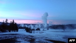 The Upper Geyser Basin at sunset in Yellowstone National Park, which extends across three western states: Wyoming, Montana and Idaho. Yellowstone was established on March 1, 1872.