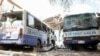 Damaged school buses are seen at the scene after a car exploded in a suicide attack near Mucassar primary and secondary school in Hodan district of Mogadishu, Somalia, Nov. 25, 2021. 