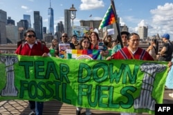 Demonstrators transverse  the Brooklyn Bridge during a clime  protestation  successful  New York connected  Sept. 20, 2024.