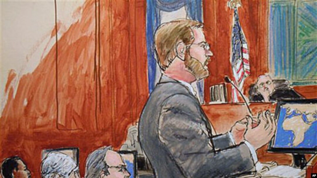 Assistant U.S. Attorney Nicholas Lewin, foreground, gives his opening statement to the jury in the trial of Ahmed Khalfan Ghailani, left, in Manhattan Federal Court in New York, 12 Oct 2010