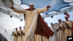 A band plays traditional music to attendees of the annual festival of Imilchil, that takes place in a small village in Morocco's Atlas mountains, Sept. 22, 2017.