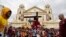 FILE - Devotees carry a replica of the Black Nazarene during the traditional blessing outside the Quiapo church in downtown Manila, Philippines, January 4, 2024.