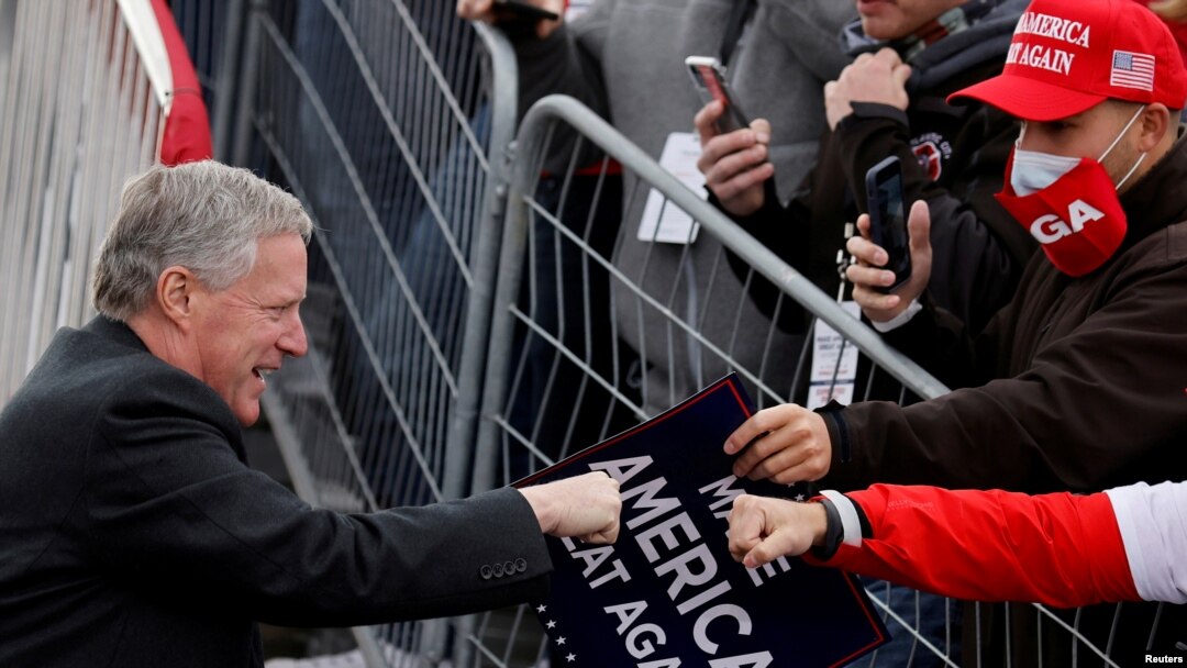 FILE - White House Chief of Staff Mark Meadows greets supporters of President Donald Trump during a campaign rally at Reading Regional Airport in Reading Penn., Oct. 31, 2020.