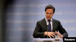 FILE - Dutch Prime Minister Mark Rutte speaks during his news conference in the Hague, Netherlands, March 19, 2020. 