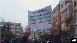 Demonstrators protest against Syria's President Bashar al-Assad after Friday prayers in Homs November 18, 2011.