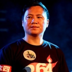 Wang Dan, one of the student leaders in the 1989 Tiananmen Square protests, takes part in a candlelight vigil for protesters crushed during the protests at the Liberty Square of the Chiang Kai-shek Memorial Hall, in Taipei, Taiwan, June 4, 2011.