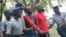 FILE: Occupy Africa Leaders Itai Dzamara (left) and Tichaona Danho (right) detained by police.