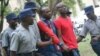 FILE: Occupy Africa Leaders Itai Dzamara (left) and Tichaona Danho (right) detained by police