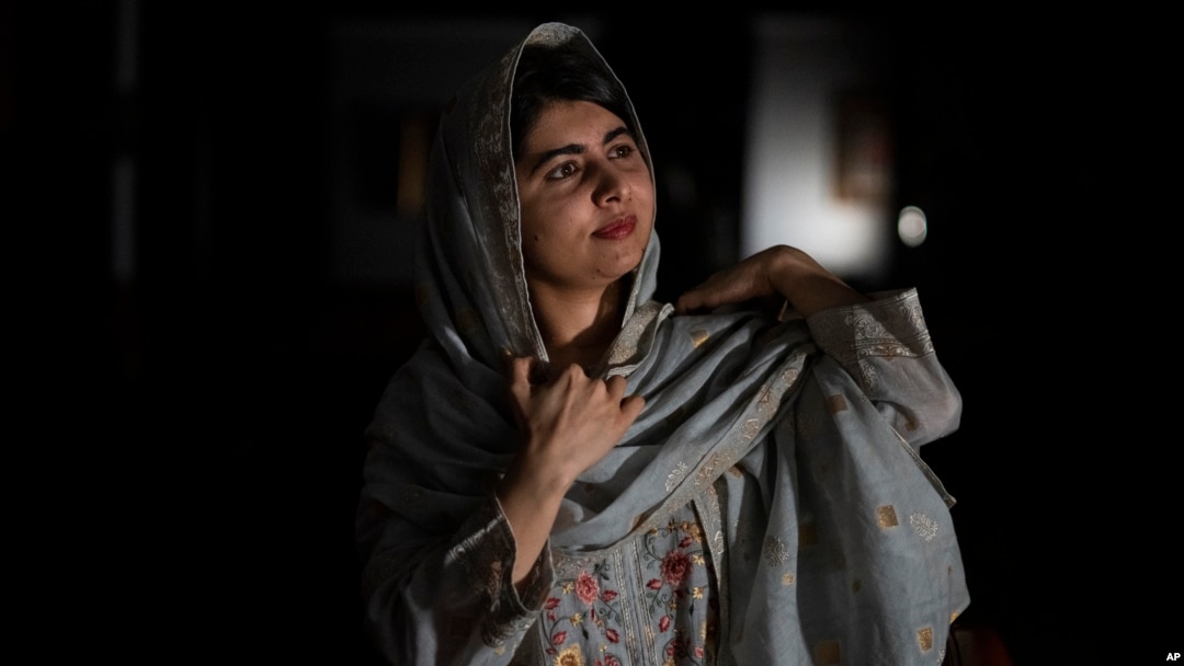 FILE - Malala Yousafzai, 2014 Nobel Peace Prize winner, poses for a photograph in Johannesburg, South Africa, on Dec. 5, 2023. A nonprofit named for her announced on June 14, 2024, that it has secured $1.5 million to get educational content to Afghan girls.