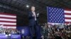 President Donald Trump walks toward the podium to speak at a rally at Total Sports Park, April 28, 2018, in Washington, Mich.