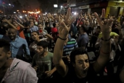 FILE - Protesters gather in central Cairo shouting anti-government slogans in Cairo, Egypt, Sept. 21, 2019.