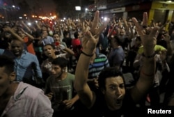 FILE - Protesters gather in central Cairo shouting anti-government slogans in Cairo, Egypt, Sept. 21, 2019.