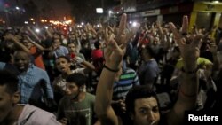 FILE - Protesters gather in central Cairo shouting anti-government slogans in Cairo, Egypt, Sept. 21, 2019.