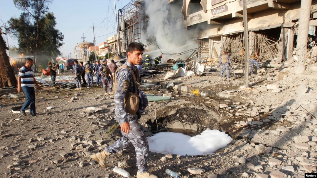 Avtomobil portlagan joy tekshirilmoqda. Kirkuk. 23-avgust 2014-yil