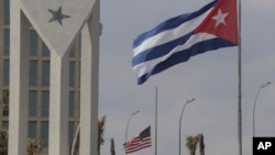 Flags of the U.S. and Cuba fly outside the U.S. embassy in Havana, Cuba, Jan.14, 2025.