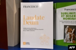 FILE - The book "Laudato Deum " ("Praise Be To You"), a thesis by Pope Francis on climate change is pictured in a book shop the day of its released, on October 4, 2023 near The Vatican.