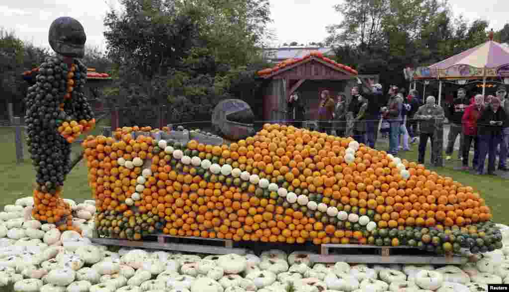 Bobsleigh athletes made of pumpkins are displayed at the pumkin festival in Klaistow, south east of Berlin, Germany.