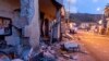 Debris from a partially collapsed house sits on a street in Fleri, Sicily Italy, Dec. 26, 2018.