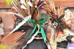 Photo shows a dancer wearing an ornate Aztec headdress, taken at the Fiestas Patrias Parade, South Park, Seattle, Washington, Sept. 19, 2015.