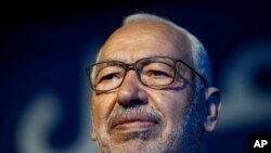 FILE - Islamist party leader and parliament speaker Rached Ghannouchi speaks during a meeting in Tunis, Tunisia, on Oct. 3, 2019. 