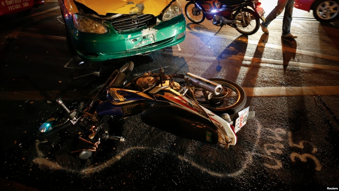 FILE - The positions of colliding vehicles are marked at the site of a road accident during the Songkran festival in Bangkok, Thailand.