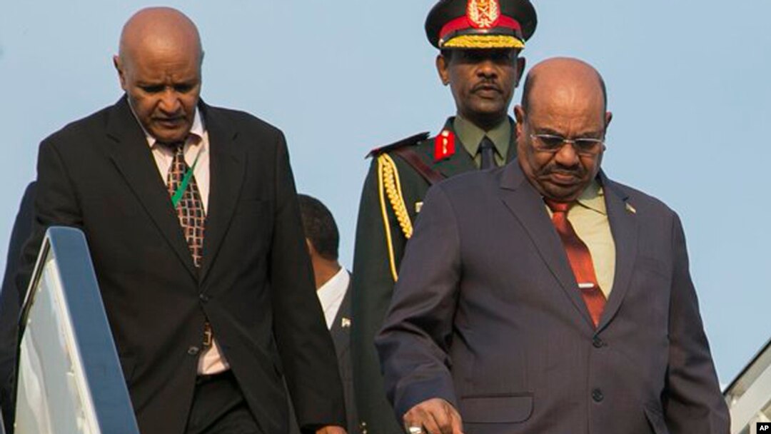 FILE - Sudan President Omar al-Bashir, right, arrives in Kigali, Rwanda, July 16, 2016, to attend an African Union summit. He defied an international warrant of arrest after public assurances from Rwandan leaders that he would not be arrested.
