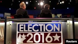 FILE - Crew members prepare the stage for the Fox Business News Republican Presidential Debate at the North Charleston Coliseum in North Charleston, South Carolina, Jan. 13, 2016. 