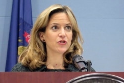 FILE - In this March 5, 2020 file photo, Michigan Secretary of State Jocelyn Benson speaks at a news conference in Lansing, Mich.