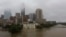 FILE - Floodwaters from Tropical Storm Harvey overflow from Buffalo Bayou in downtown Houston, Texas, Aug. 28, 2017.