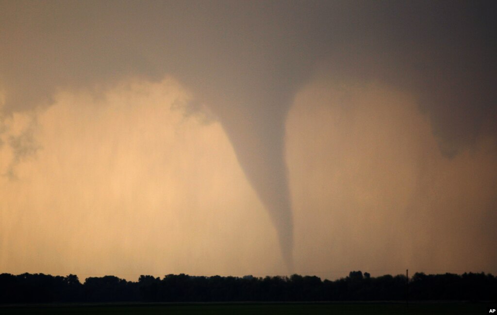 A tornado forms and touches down north of Soloman, Kansas April 14, 2012. (AP Photo)