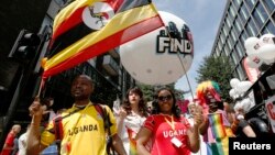 Participants from Uganda, where homosexuality is outlawed, participate in the annual Pride London parade which highlights issues of the gay, lesbian and transgender community, London, June 29, 2013. 