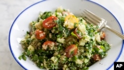 A dish of tabbouleh filled with herbs and spices. (AP Photo/Matthew Mead)