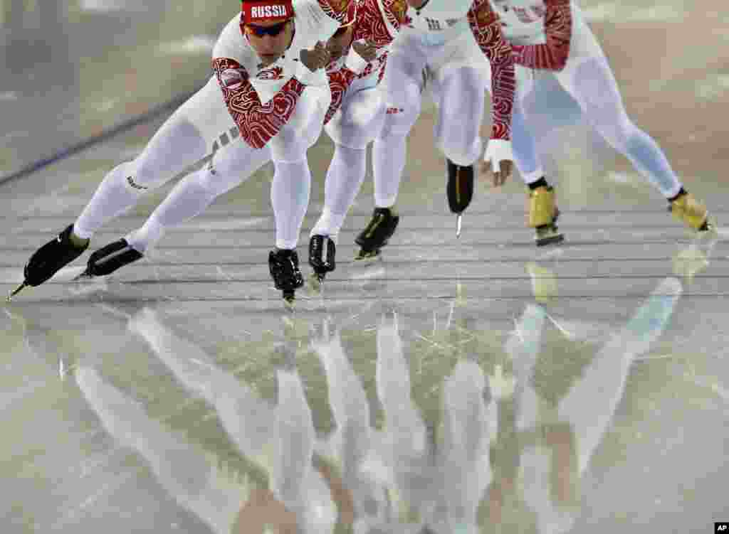 Speedskaters from Russia train at the Adler Arena Skating Center prior to the opening of the 2014 Winter Olympics in Sochi, Russia. 