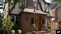 This Oct. 18, 2016, photo shows the exterior of a house in the Jamaica Estates neighborhood of the Queens borough of New York, where Republican presidential candidate Donald Trump spent his early childhood.