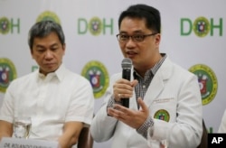 Department of Health Undersecretary Dr. Rolando Enrique Domingo, right, and Philippine General Hospital Director Dr. Gerardo Legaspi, attend a press conference at the Department of Health office in Manila, Philippines, Feb. 2, 2018.