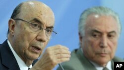 Economy Minister Henrique Meirelles (left) joins President Michel Temer during a press conference on new measures by the governement to stimulate the economy, at the Planalto Presidential Palace, in Brasilia, Brazil, Dec. 15, 2016.