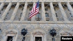 FILE - A fence surrounds the U.S. Department of Commerce in Washington, Oct. 5, 2013. A 16-day government shutdown in 2013 furloughed hundreds of thousands of federal workers.