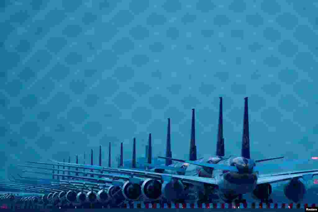 Thai Airways idle airplanes are seen parked on the tarmac of Suvarnabhumi Airport in Bangkok, Thailand.