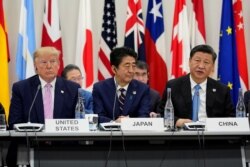 지난 6월 오사카에서 열린 G20 정상회의에서 도널드 트럼프 미국 대통령과 아베 신조 일본 총리 시진핑 중국 국가주석이 나란히 앉아있다.
